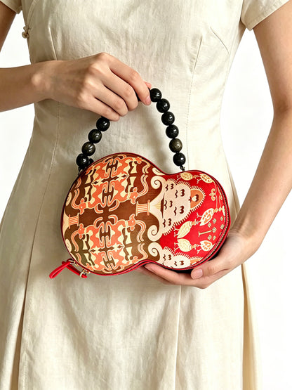 Zhang Hecai Fiery Trees & Silver Blossoms Shu Brocade Gourd Handbag | 张和才火树银花不夜天蜀锦