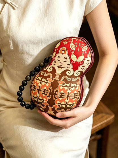 Zhang Hecai Fiery Trees & Silver Blossoms Shu Brocade Gourd Handbag | 张和才火树银花不夜天蜀锦